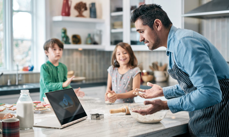 Image of Dad Baking with Kids and Device