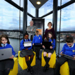 a group of people sitting on a bench