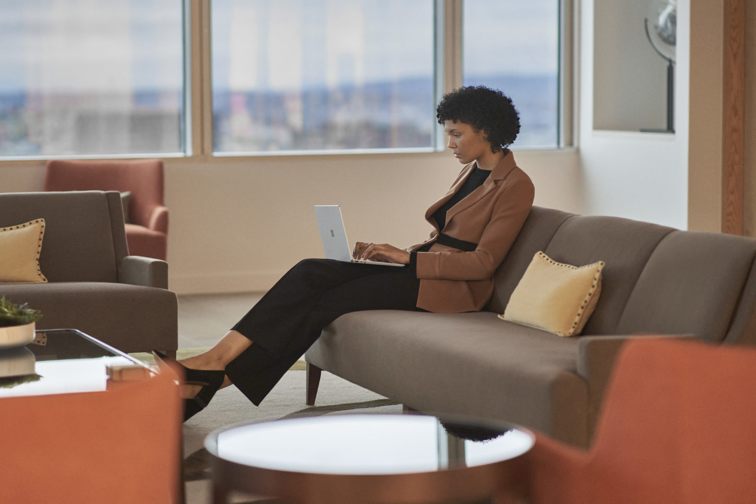 Woman with Surface Laptop Go