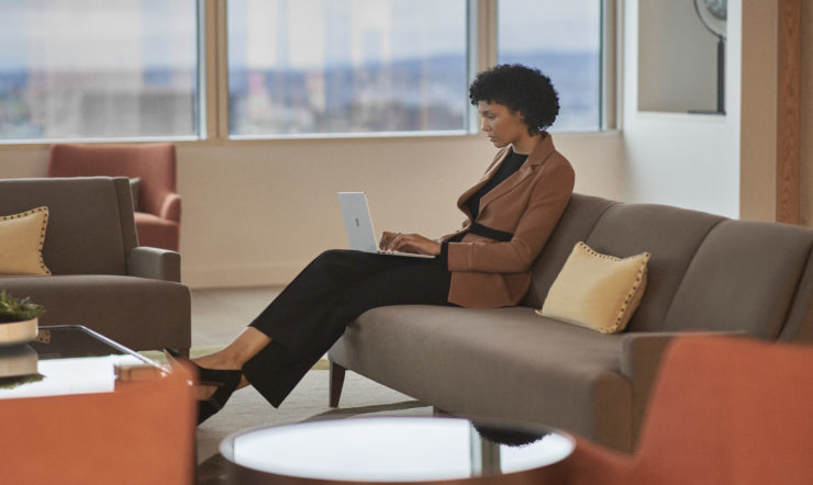 Woman with Surface Laptop Go