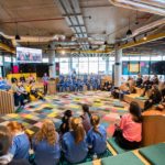 a group of people sitting around in a circle