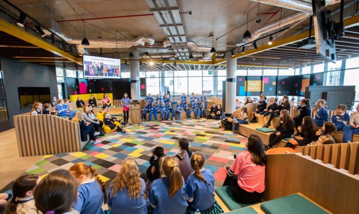 a group of people sitting around in a circle