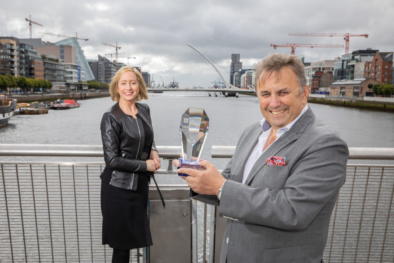 Aisling Curtis, John Purdy standing next to a dock