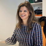 a woman smiling for the camera