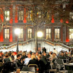 a group of people performing on stage in front of a crowd