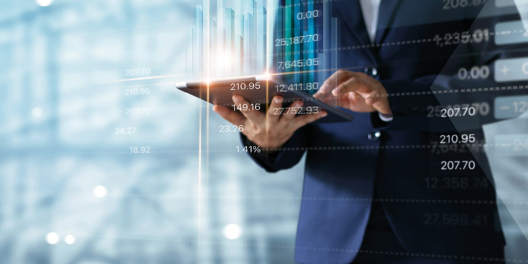 a person sitting in front of a laptop