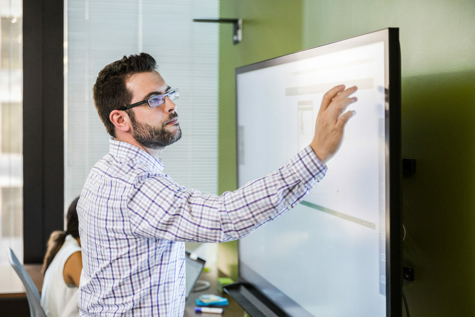a man standing in front of a window