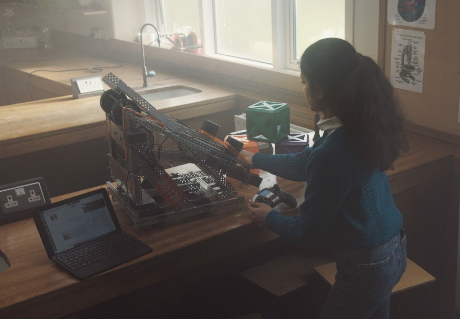 a person sitting at a desk in front of a computer