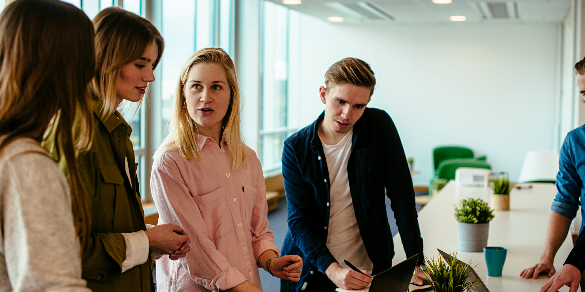 a group of people standing next to a person