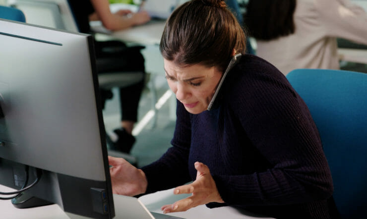 Woman on the phone behind desk