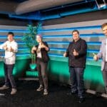 Maxim and guests in a studio giving the thumbs up