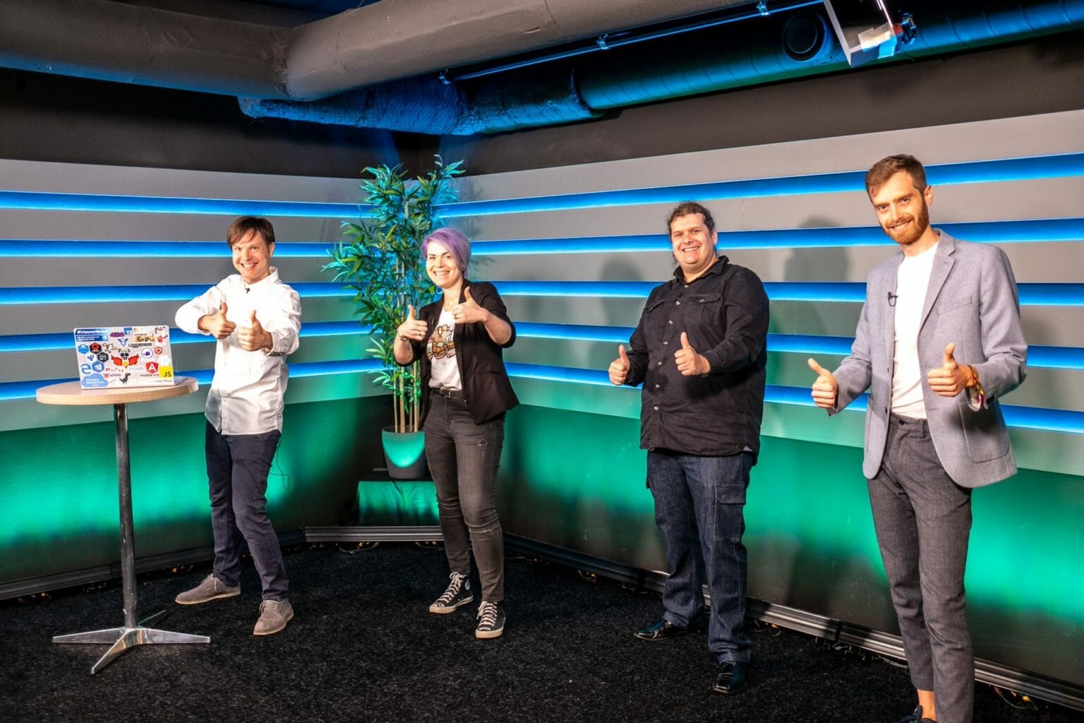 Maxim and guests in a studio giving the thumbs up