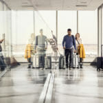 Enterprise team achieving in airport during business travel and mobility.