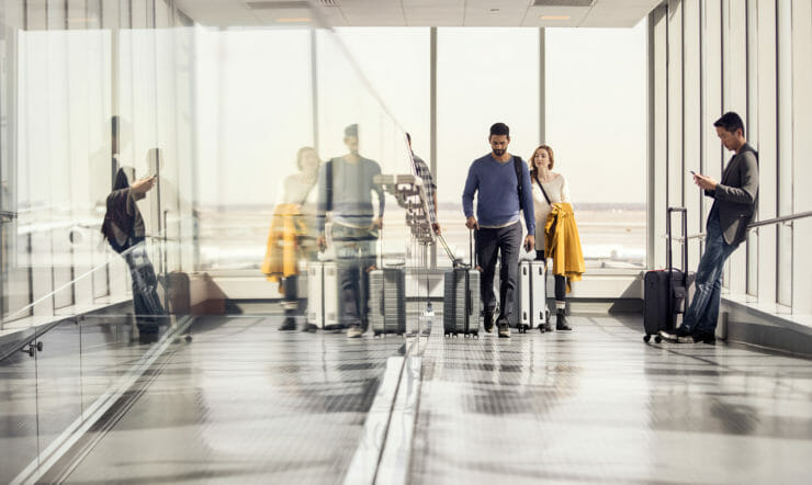Enterprise team achieving in airport during business travel and mobility.