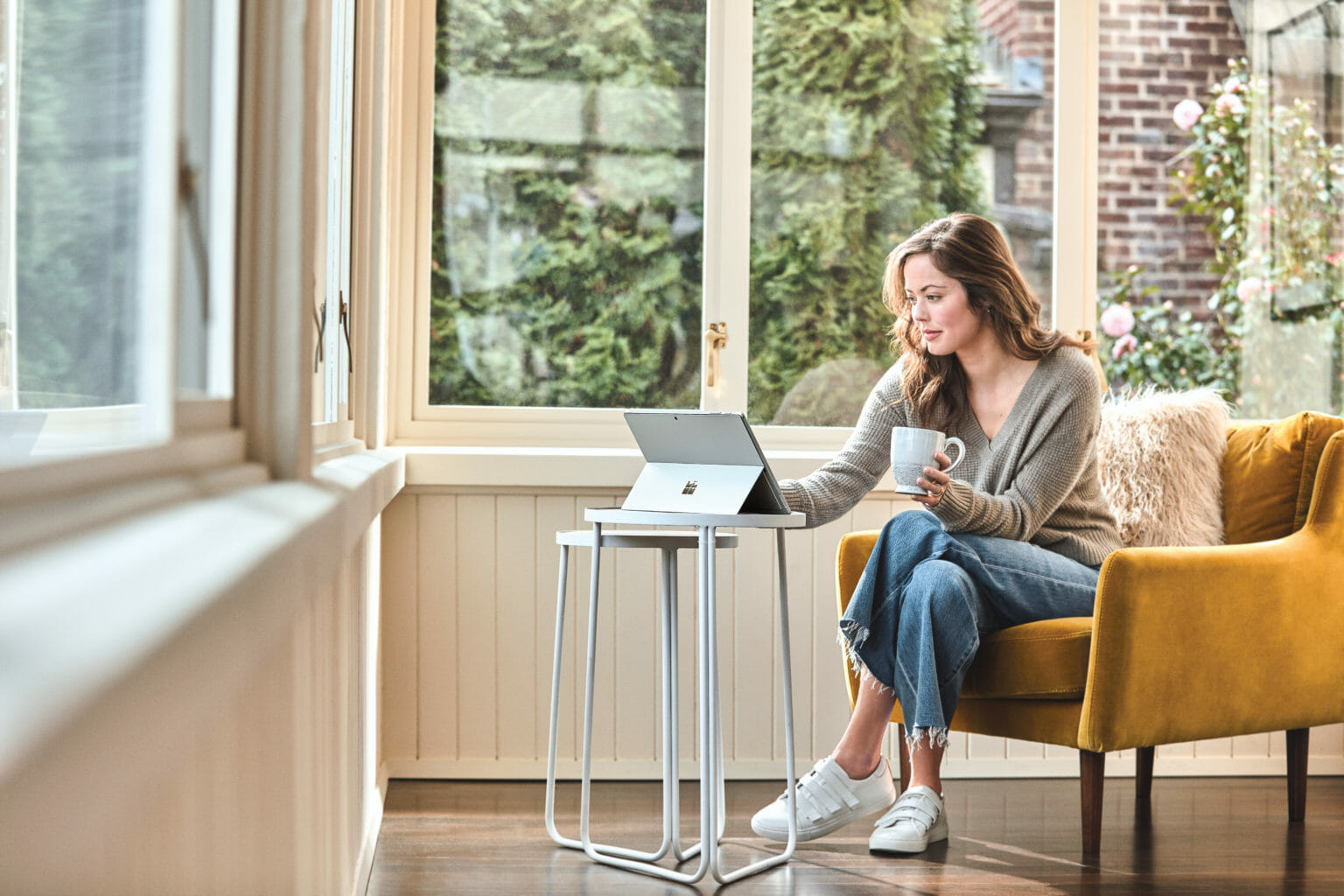 Woman sitting in chair inside