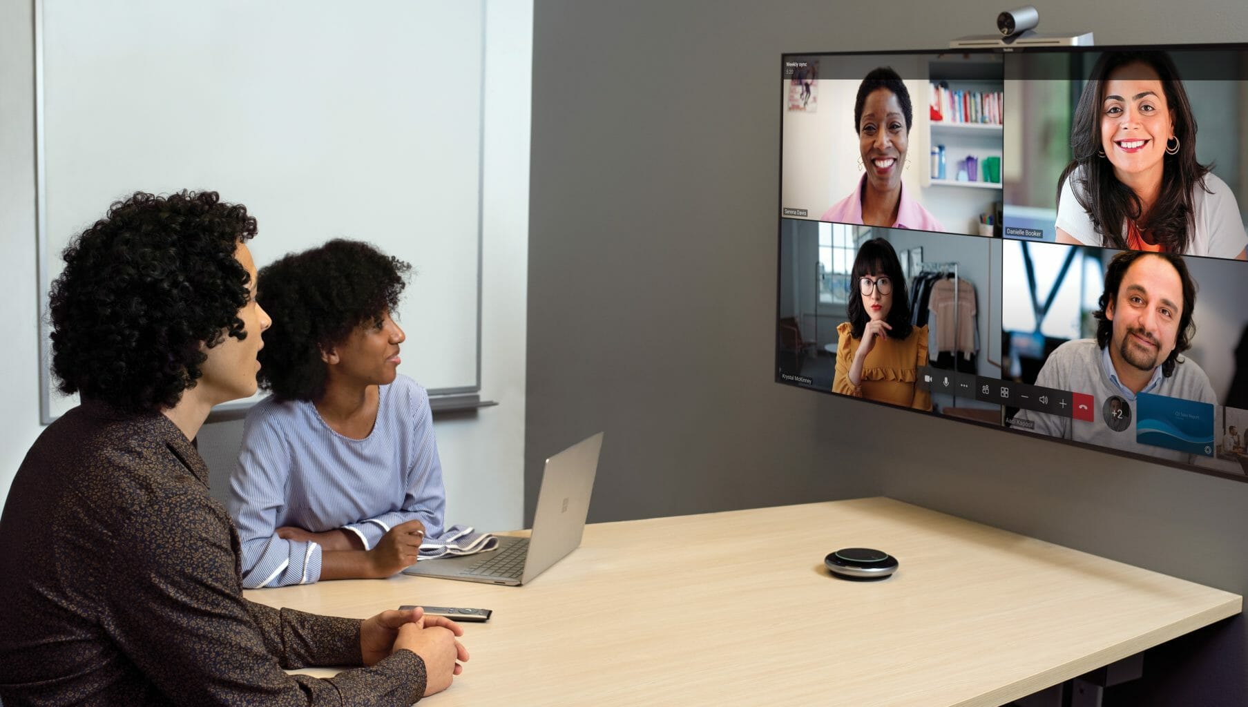 People smiling at the screen