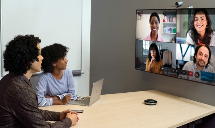 People smiling at the screen