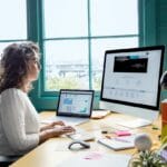 woman sitting in front of computer