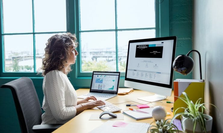 woman sitting in front of computer