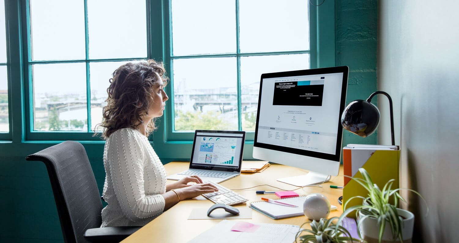 woman sitting in front of computer