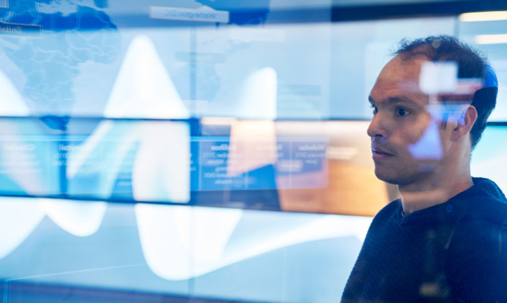 A man looking at a screen