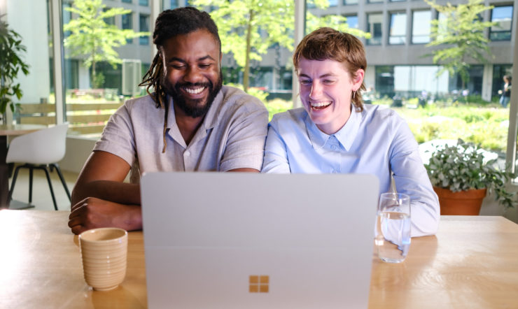 Two people with Surface Laptop Studio