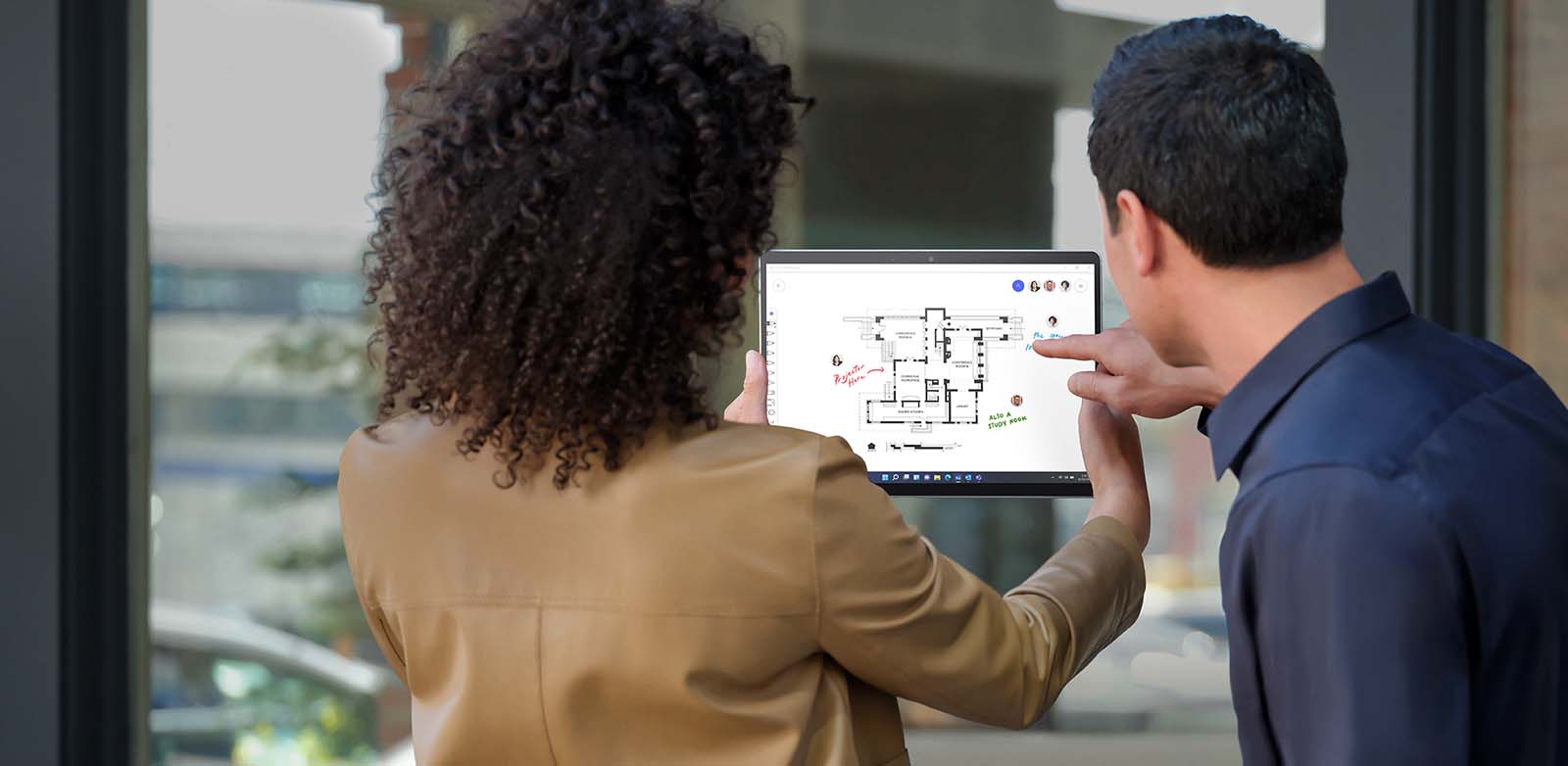 Woman and man with device