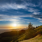 Expansive view of ocean coast at sunset across the foothills in Mount Tamalpais State Park, Mill Valley, California
