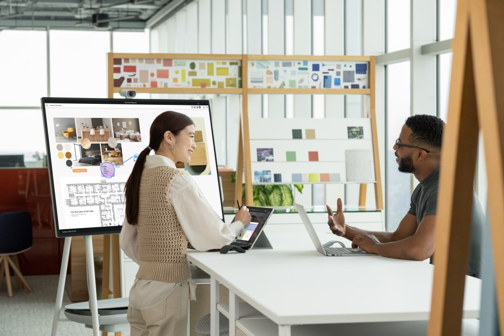 Woman and man talling in an office