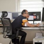 Ramazan in his home office