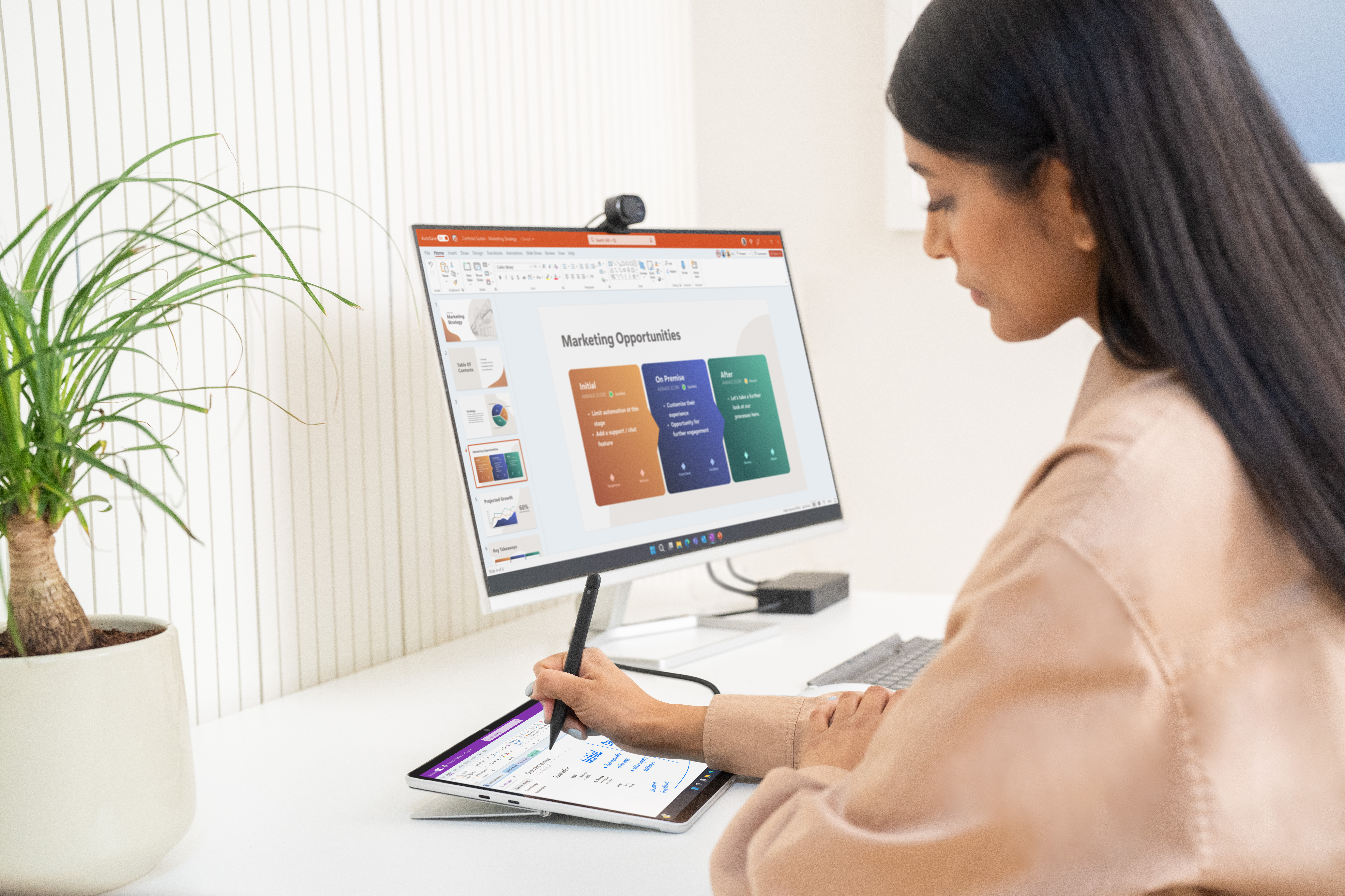 Woman with Surface Pro 9 and seperate screen