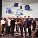 People standing and smiling to the camera