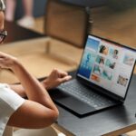 A woman looking at a computer