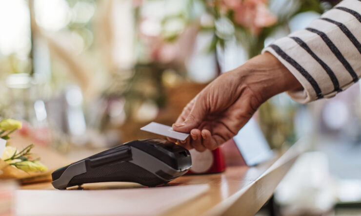 a hand on a transaction machine