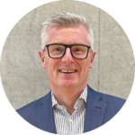 A man looking into the camera smiling