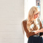 Asian woman looking at a tablet