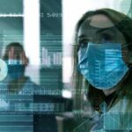 Scientist looking at a screen with data