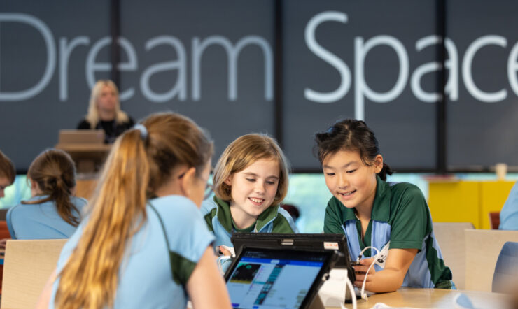 three people sitting around the table
