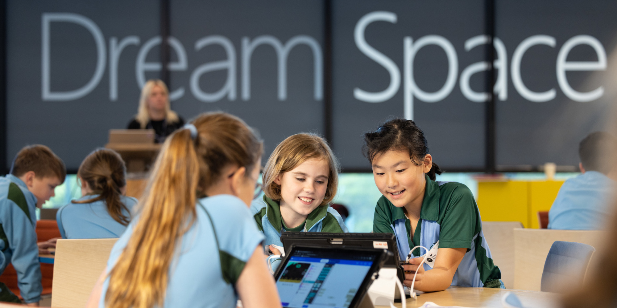 Three people sitting around the table
