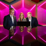 Minister Calleary, Anne Sheehan & James O'Connor looking at a laptop