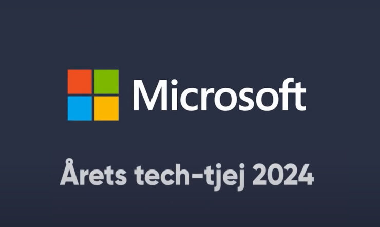 Image of one women and one man sitting with a computer